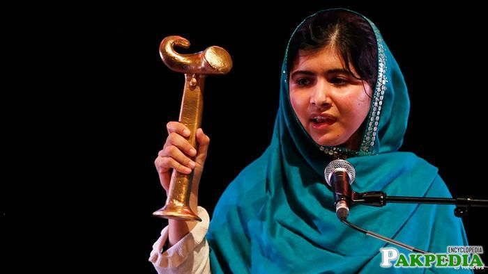 Malala Yousafzai displaying her medal during the award ceremony