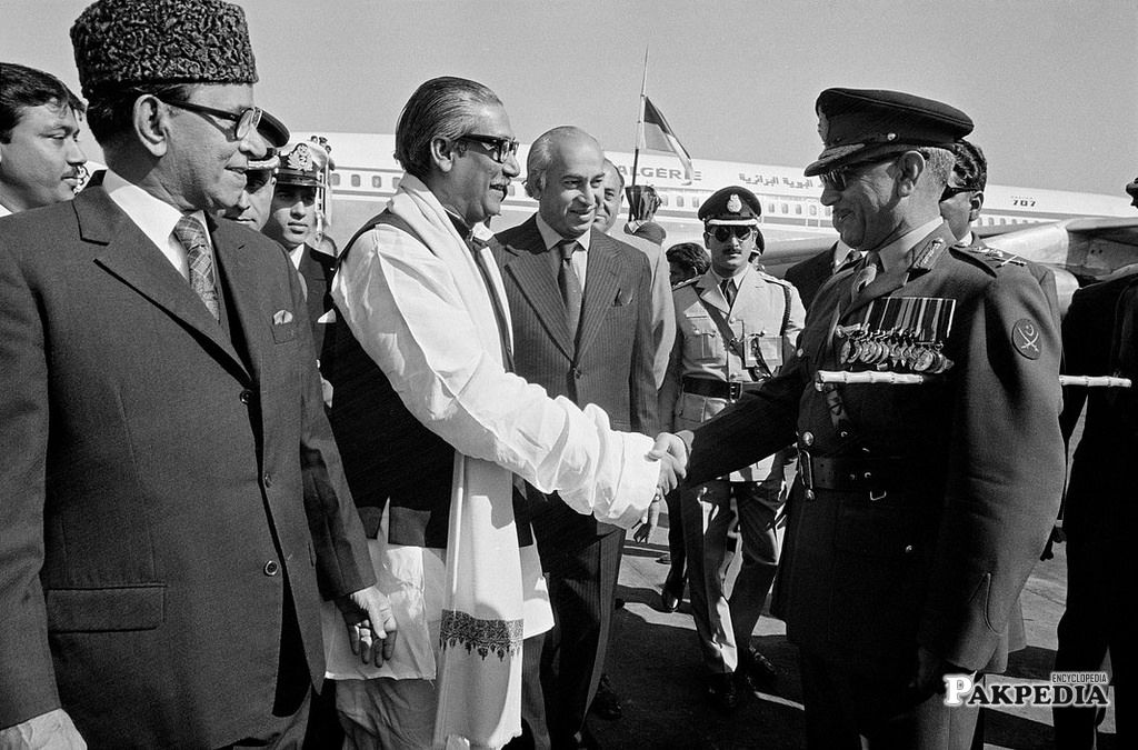 Shaking hand with Mujibur Rehman