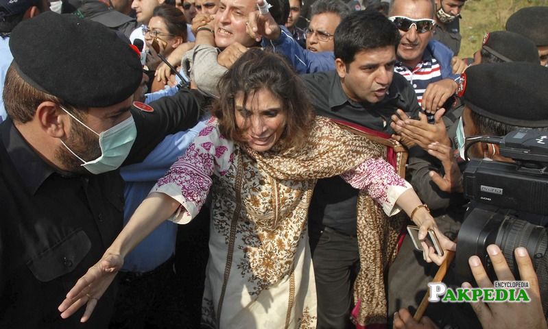 Police arresting Andleeb abbas during protest