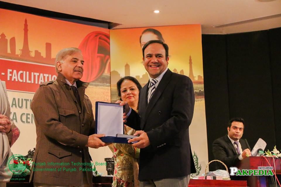 Receiving award from CM of punjab