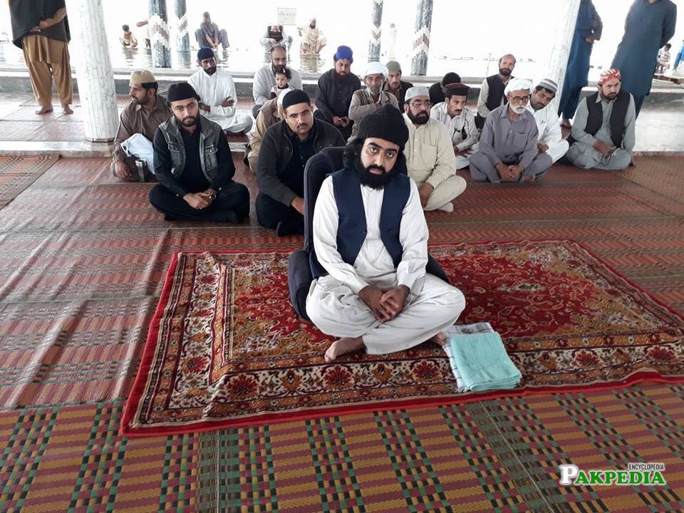 Nizam ud din sitting with his followers
