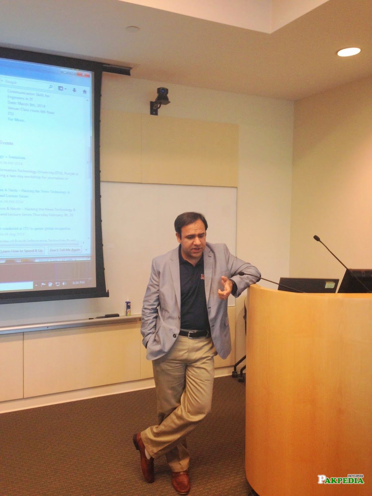 Dr umar while delivering presentation