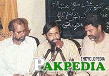 Zaidi performing with his companions, Hussain Akhtar and Shakeel Haider.