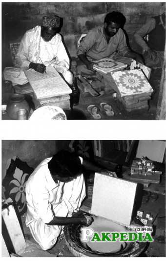 Workers while doing tile painting